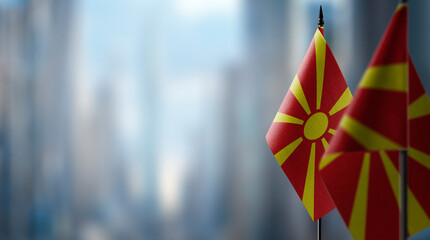 Small flags of the Macedonia on an abstract blurry background