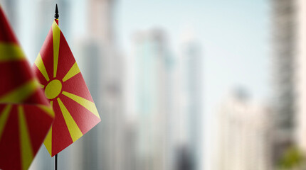 Small flags of the Macedonia on an abstract blurry background