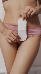 Young asian sexy woman wearing panties with menstrual pad, sanitary napkins. sanitary pads, critical days, menstrual cycle, Menstruation, woman health.