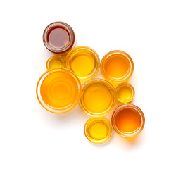Composition from different jars with honey on isolation top view.