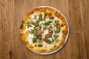 delicious italian pizza on a wooden table
