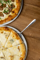delicious italian pizza on a wooden table
