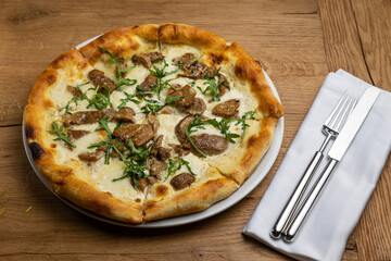 delicious italian pizza on a wooden table
