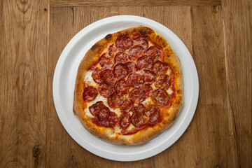 delicious italian pizza on a wooden table
