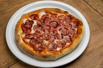 delicious italian pizza on a wooden table
