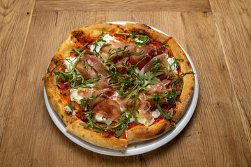 delicious italian pizza on a wooden table
