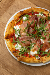 delicious italian pizza on a wooden table
