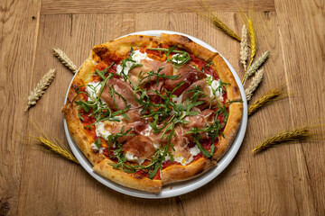 delicious italian pizza on a wooden table
