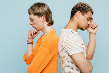 Side view sad young couple two gay men wear casual clothes together stand back to back pop up head...