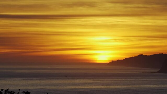 Golden dawn above the horizon on the cliffs of northern Spain in Asturias.