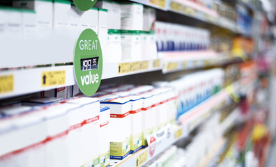All our products are great value for your money. shelves stocked with various medicinal products in a pharmacy.