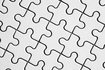 jigsaw puzzle. back side. white pieces forming flawless pattern