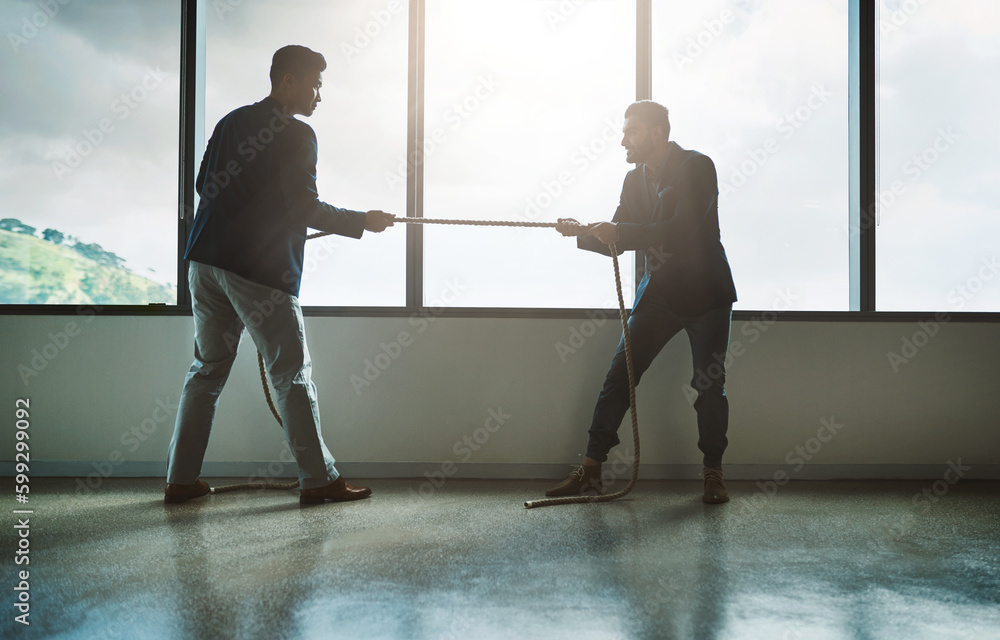 Poster no one pushes you to achieve more than your competitor. two young businessmen pulling on a rope in a