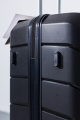 Black beautiful suitcase for tourist trips. High-quality black suitcase