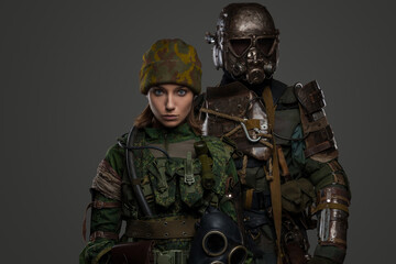 Portrait of post apocalyptic female and male soldiers surviving in radioactive catastrophe.