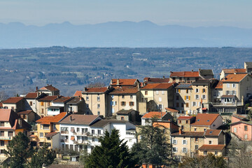 Aerial view of dense historic center of Thiers town in Puy-de-Dome department, Auvergne-Rhone-Alpes region in France. Rooftops of old buildings and narrow streets