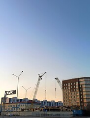 Fototapeta na wymiar construction in the city at sunset