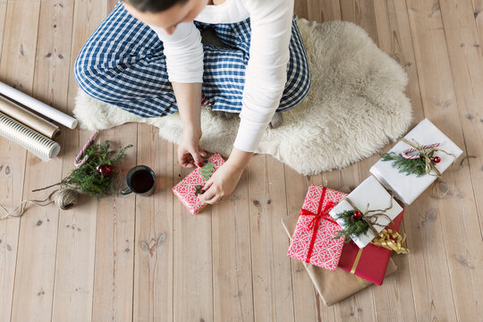 Woman wrapping Christmas gift