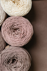 Skeins of beige knitted yarn for weaving top view
