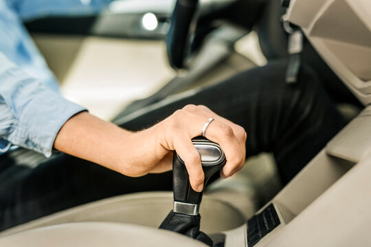Mid section of woman driving car