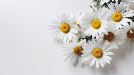 Fototapeta na wymiar Small bouquet of daisies lying on a white table top view. AI generated