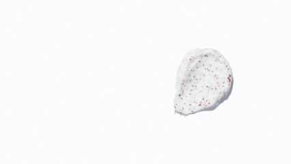 Smears of body scrub on white background. Fruit and berry body scrub texture of the swatch. Cosmetic smear