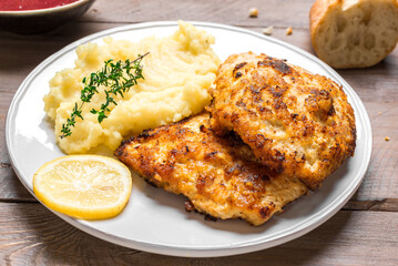 Schnitzel or breaded chop with mashed potatoes