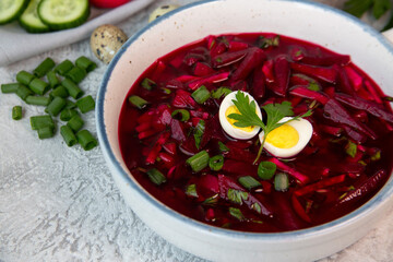 Cold beetroot soup with vegetables, eggs, herbs. Traditional cuisine. Healthy food. Vegetarian food.