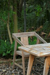 Wooden table and chairs for outdoor with nature as background. Kursi dan meja taman