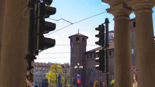 Acaja safe behind Piazza Castello crowded with people on a sunny spring afternoon 2