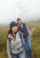Having fun on their hike. a beautiful young woman out hiking with her boyfriend.