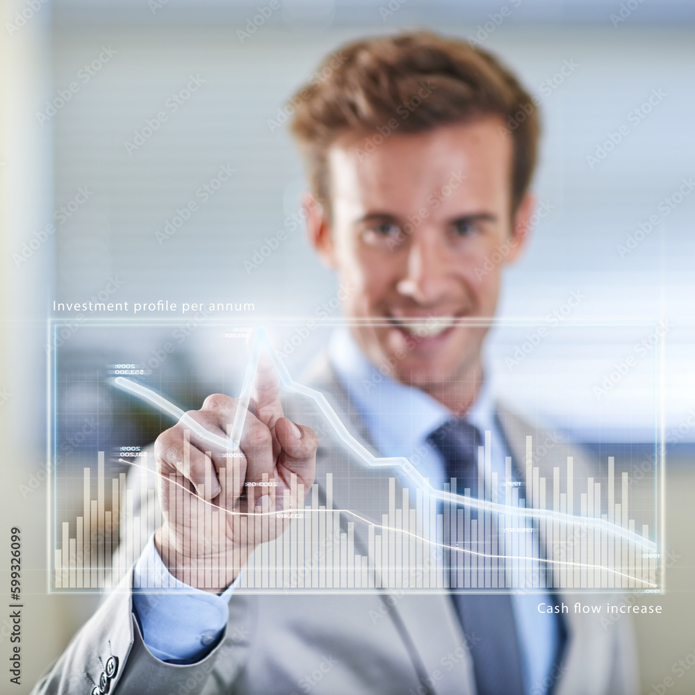 Poster things are looking up. a smiling young businessman using a digital interface.