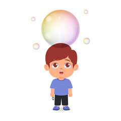 Cute boy amazed with big soap bubbles