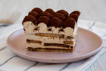 Homemade Italian Tiramisu Dessert on a Plate, side view. Close-up.