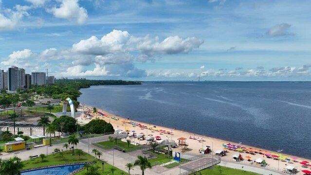 Ponta Negra Beach At Manaus Amazonas Brazil. Seascape Sunny Day. Business Sky Downtown Cityscape. Business Outside Downtown District Up Above. Business Cityscape Building Architecture.