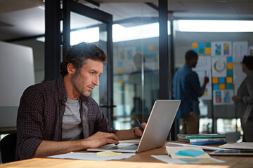 Youve gotta work hard to achieve your goals. a businessman working in his office.