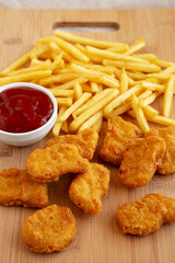 Chicken Nuggets and French Fries with Ketchup Ready to Eat. Close-up
