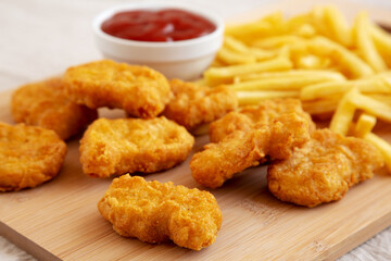 Chicken Nuggets and French Fries with Ketchup Ready to Eat. Close-up.