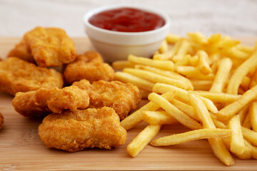 Chicken Nuggets and French Fries with Ketchup Ready to Eat. Close-up.