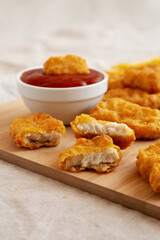 Chicken Nuggets and French Fries with Ketchup Ready to Eat, side view.