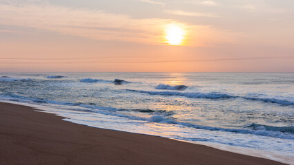 Fototapeta na wymiar Beach Sands Shoreline Ocean Wave Wash Horizon Sunrise Haze Landscape.