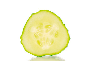 One slice of ripe gherkin cucumber, macro, isolated on white background.