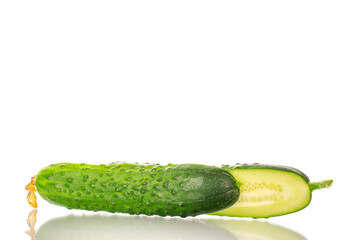 Two halves of a ripe gherkin cucumber, macro, isolated on a white background.