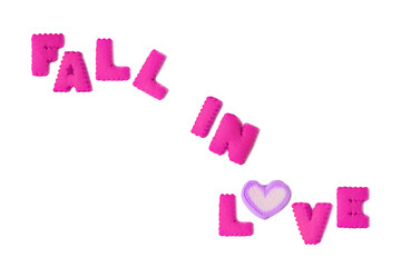 Text of FALL IN LOVE spelled with magenta alphabet cookies and purple marshmallow candy on transparent backdrop, png file