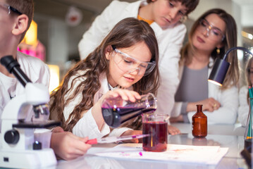 Elementary school children doing experiments in the laboratory