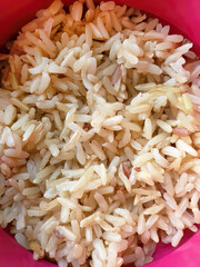 Close up, Top view over cooked unpolished half milled Jasmine rice, high nutritional food, long grain brown rice, vitamin B, aroma and delicious, Thai rice