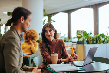 Cheerful coworkers on working break.