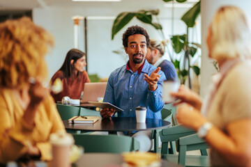 Coworkers socializing at lunch.