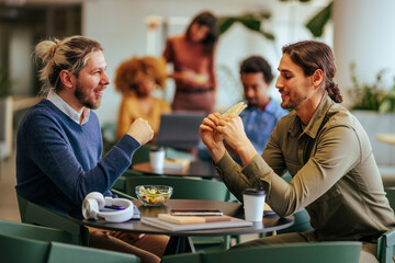 Businessmen enjoying lunch break and socializing.