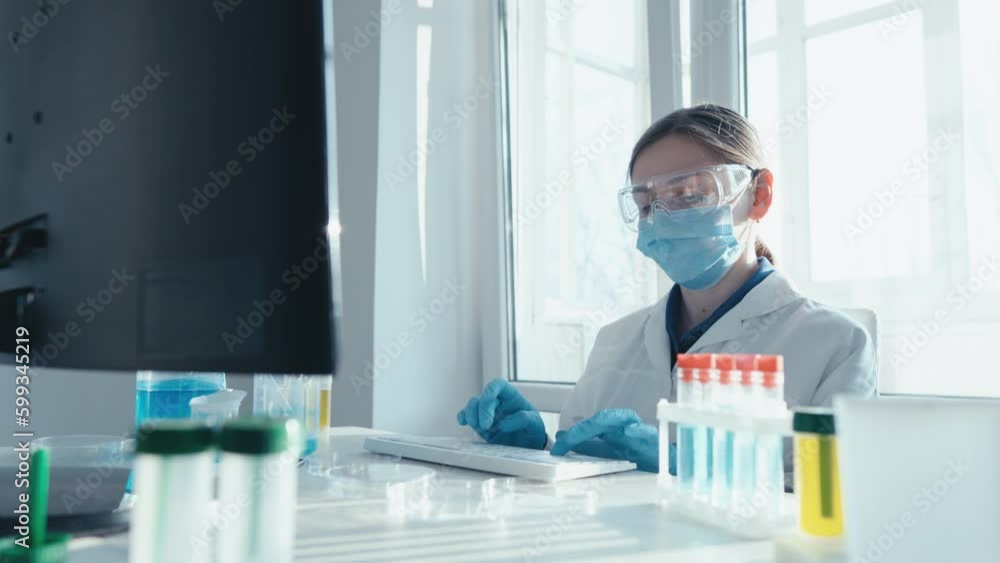 Poster a medical researcher analyzes clinical trials in the laboratory to establish the effectiveness of ne